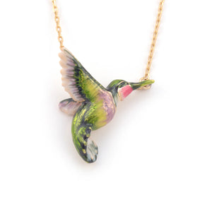 Close-up of gold-plated enamel hummingbird pendant necklace with green, pink, and purple detailing.
