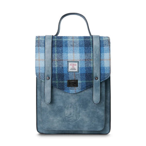 Image of a Harris Tweed backpack that also doubles as a laptop bag. It has a blue PU leather body and a blue Harris Tweed tartan fabric top. 