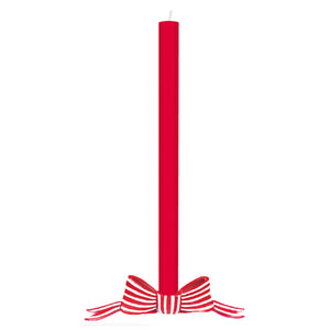 Red candle with a decorative bow on a white background