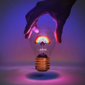 Cordless rainbow lightbulb glowing in the dark with hand above – USB rechargeable LED lamp