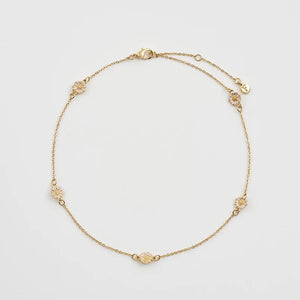Full Necklace View: Fable England Daisy Chain Choker – gold-plated chain with five hand-painted enamel daisies.