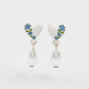 Silver heart drop earrings with blue enamel forget-me-not flowers and pearl detailing, front view on white background.