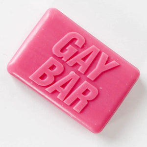 Hot-pink novelty soap bar embossed “GAY BAR” on white background – rose-scented LGBTQ+ gift from Contempo.