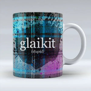 Scottish Glaikit mug with tartan pattern and bold text on front.