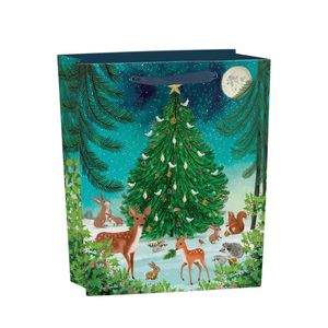 Heart of the Forest gift bag featuring woodland animals, deer, rabbits, and hedgehogs around a Christmas tree under a starry winter sky, recyclable kraft paper bag with ribbon handles.