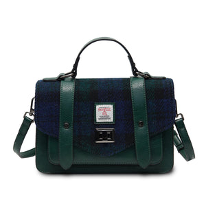 Ladies Harris Tweed Satchel with a green PU leather body and with a blue and green tartan fabric. The shoulder strap is draped over the back.
