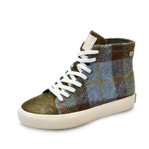 A single trainer showing the shoes from a side angle. You can see the white laces and the green chestnut and blue tartan Harris Tweed finish.