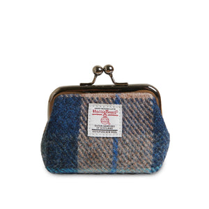 Front view of Islander coin purse in navy and beige Harris Tweed with metal kiss clasp and official Harris Tweed label.