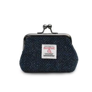 Coin purse made from Harris Tweed in a navy herringbone design with a clasp closer. 