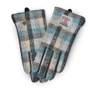 Front view of ladies Harris Tweed® gloves in Islander tartan with black leather trim, showcasing the check pattern and classic silhouette.
