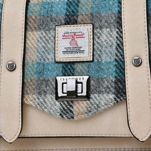 Close up of the contrast between the PU leather and the Islander Tartan Harris Tweed fabric.