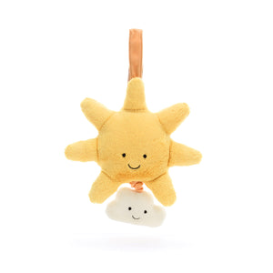 A close-up view of a Jellycat Amuseable Sun Musical Pull, showcasing its luxuriously soft yellow fur, embroidered smile with rosy cheeks, and floppy rays for playful fun.