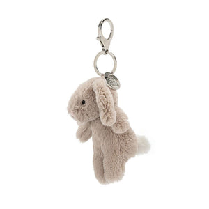 See the playful details of the Bashful Bunny Charm! This biscuity-soft pal boasts a bouncy tail & clips easily onto bags, backpacks or keys for endless cuteness.