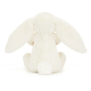 Back View: Who could resist a hug? The Jellycat Bashful Bunny with its irresistibly soft fur and a beautifully wrapped present.
