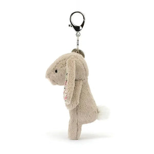 See the playful details of the Blossom Beige Bunny Charm! This soft friend boasts fluffy ears, a charming tail & a sturdy clip for endless adventures.