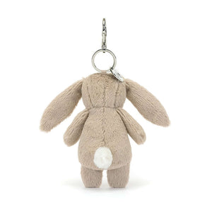 Check out the soft fur & bouncy tail of the Blossom Beige Bunny Charm! This adorable pal clips onto bags, spreading springtime vibes wherever you go. Hop to it & grab yours!