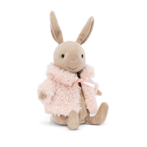 Jellycat Comfy Coat Bunny with a mallow-pink coat and beige fur, shown at a slight angle to showcase its long ears.