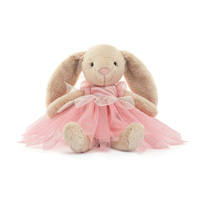 Jellycat Lottie Bunny Fairy wearing a pink satin bodice, three layered mesh tutu with a petal peplum and little pink ribbons on the ears. And a cute little pink nose.
