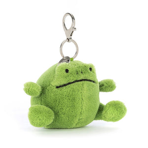 Angled View: Jellycat Ricky Rain Frog Bag Charm! This super soft, leaf-green plush frog features a cheeky grin, squeezable paws, and a secure clasp for all your adventures.