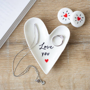 The Love You Heart Trinket Dish shown with a ring and necklace placed inside. 