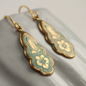 Gold and green enamel Victorian drop earrings with pansy and feather design on curved brass base.