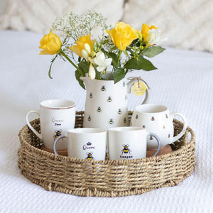 A picture of the mugs in a setting with other bee themed products. 