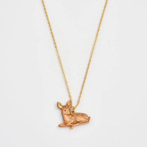 Resting Fawn Gold Chain Necklace pendant close-up on white background.