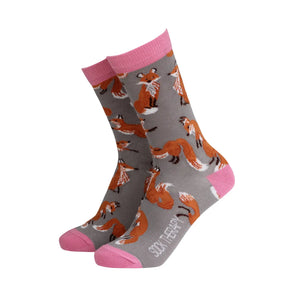 Women’s bamboo socks with cute fox pattern on grey background and pink heel, toe, and cuff.