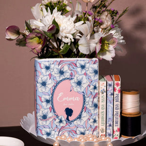 Small Emma book vase displayed on a tray with flowers, thread spools, pearls, and matching Jane Austen novels.