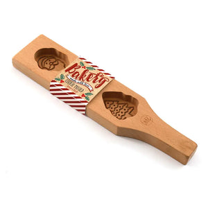 Wooden Christmas cookie baking mould with Santa face and Christmas tree embossed designs made from natural beechwood.