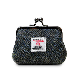 Coin purse with a clasp closer made from Harris Tweed in a black and white herringbone pattern.