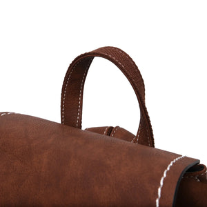 The top handle in dark brown leather of the Islander backpack.