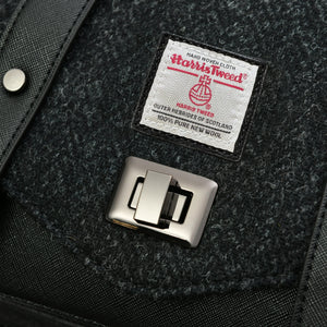 Close up of the Genuine Harris Tweed Authentication label on the Black Herringbone satchel.
