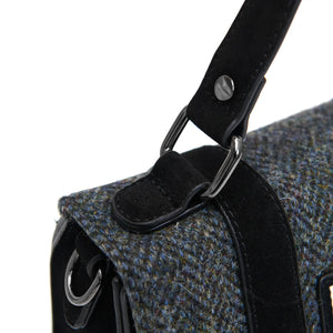 Close up of the handle of the Islander Black Herringbone Harris Tweed Suede satchel style handbag.