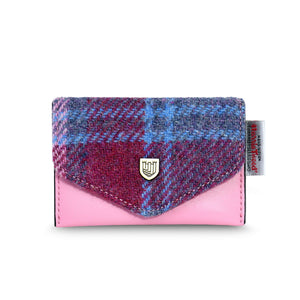 Islander Harris Tweed Card Holder. It has a pink leather body and a pink and blue tartan cover. The Islander logo is displayed at the front and the genuine Harris tweed certification on the side. 