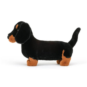 Jellycat Freddie Sausage Dog Large children’s soft toy facing the side so that we can see his long tail. 