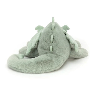 Jellycat Sage Dragon children’s soft toy from behind, the long mint green tail curling around its body. 