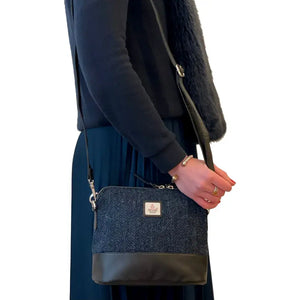 Lady wearing a Maccessori Harris Tweed Shoulder Bag with a blue herringbone design.