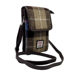 Blue and brown tartan Harris Tweed mini crossbody shoulder bag with the adjustable strap showing. 