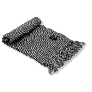 Rolled up black & white dogtooth lambswool scarf.