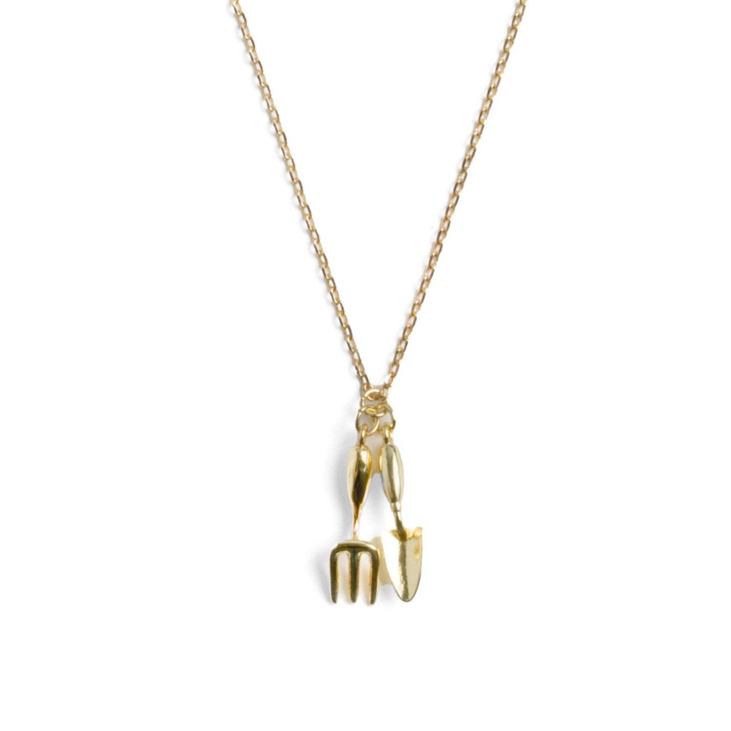 Pendant detail showing intricate tool engravings