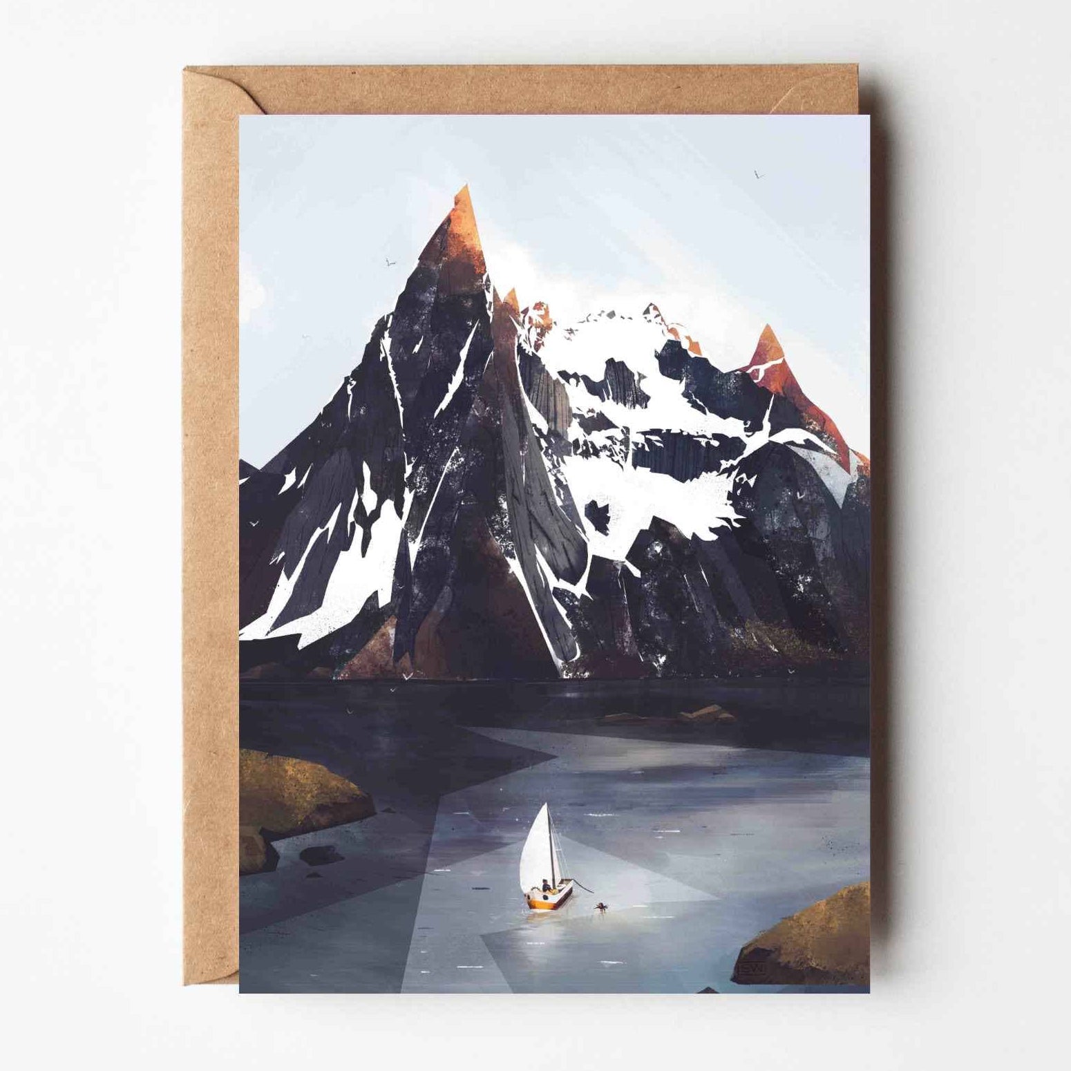 Greeting card featuring an illustrated Norwegian mountain scene with a lone sailboat on icy water and snow-capped peaks, paired with a kraft envelope.