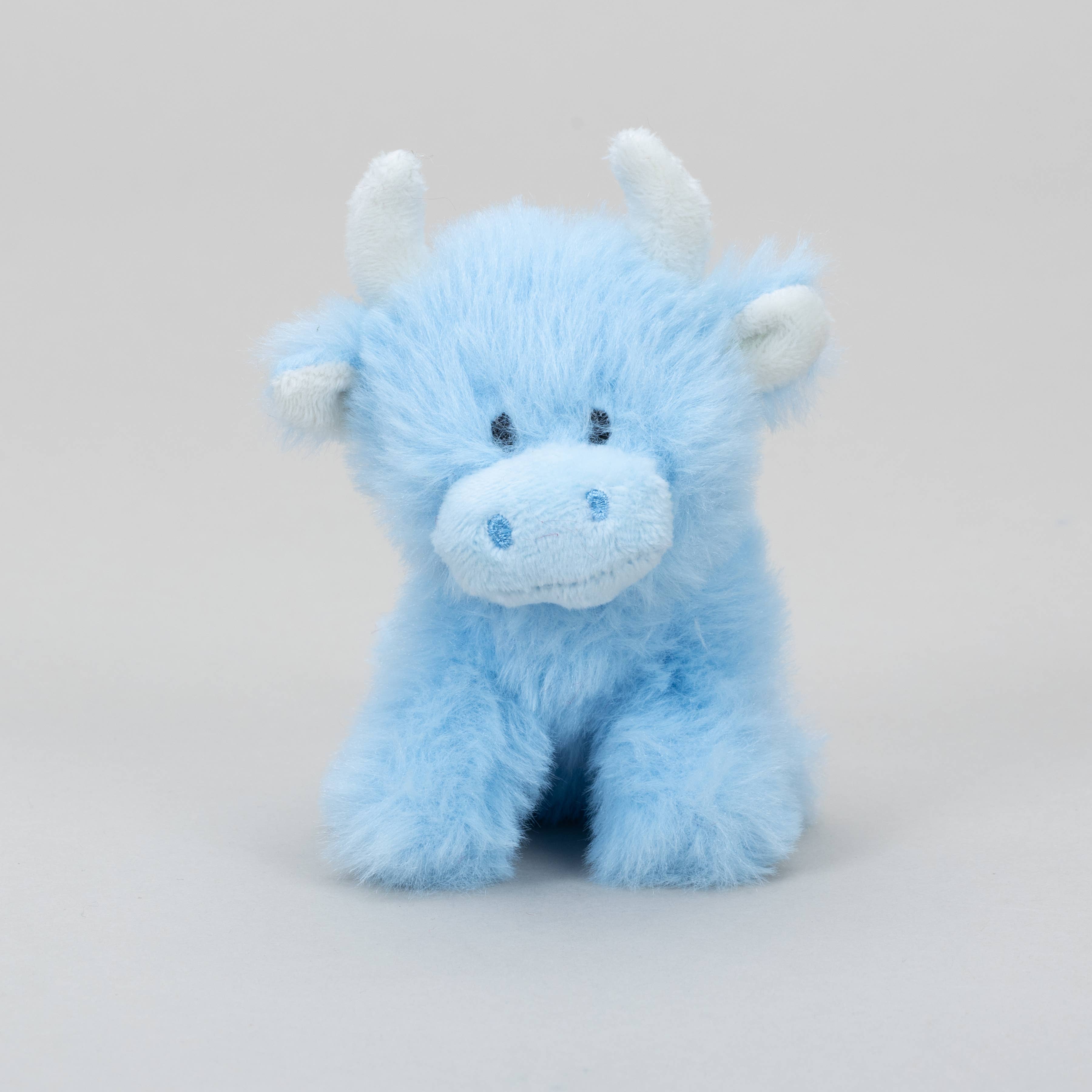 Baby blue mini highland cow plush front view on grey
