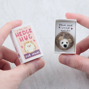 A Big Fat Hedgehug For Mum matchbox gift held in hands, revealing a handmade wool felt hedgehog inside with a heartfelt message.