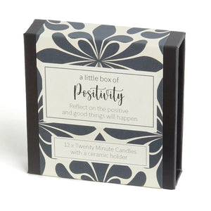 Positivity Box: A Little Box Off candle set with the word "Positivity" and a bright, uplifting image. Includes 12-minute beeswax candles for a mindful moment of optimism.