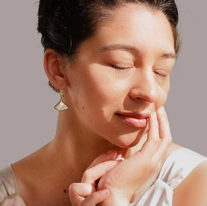 Model wearing Abalone Pearl Fan Earrings – A woman wearing the delicate Abalone Pearl Fan Earrings, showcasing their subtle iridescence and timeless Art Deco charm.