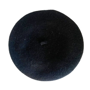 Back view of plain black wool beret showing classic design with small stalk.