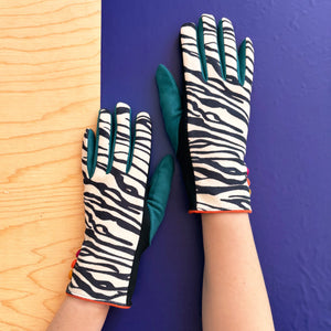 Stylish animal print gloves with soft-touch lining in zebra design.
