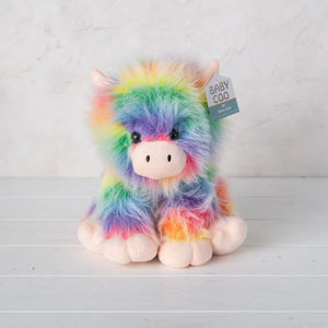 Front view of Baby Coo Highland cow plush toy with rainbow fur and soft features.