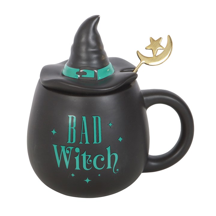Close-up of Bad Witch mug with mint green lettering and hat lid.